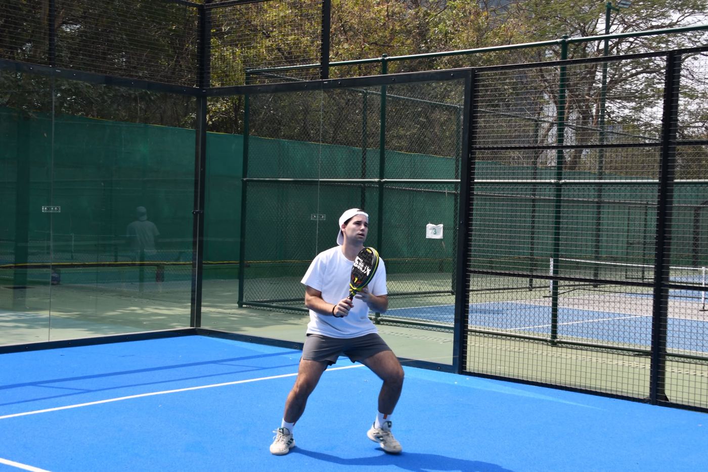 Iñigo San Román, founder of Padel Roamers, on a padel court